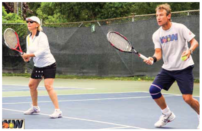 Mats Wilander (right) leads players in dynamic drills and tennis clinics.