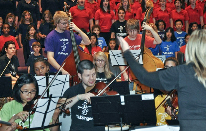 Paul Casey plays with OrKidstra (KidPlayers and KidSingers) at the annual Peace Day event at City Hall in September 2012. Photo: Gary McMillen