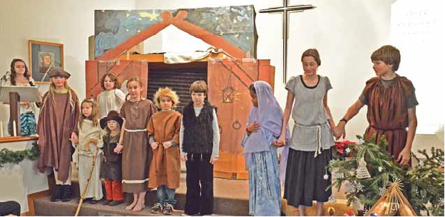 A cast of shepherds, angels, Mary and Joseph ready to take a bow at the end of the annual Christmas Pageant. Photo: Alexandra Demke