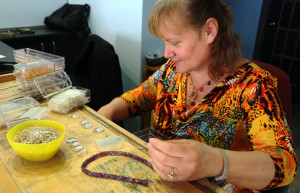 Joyce Barnard at work making handmade jewellery for Joy Creations. Photo: Ben Bulmer